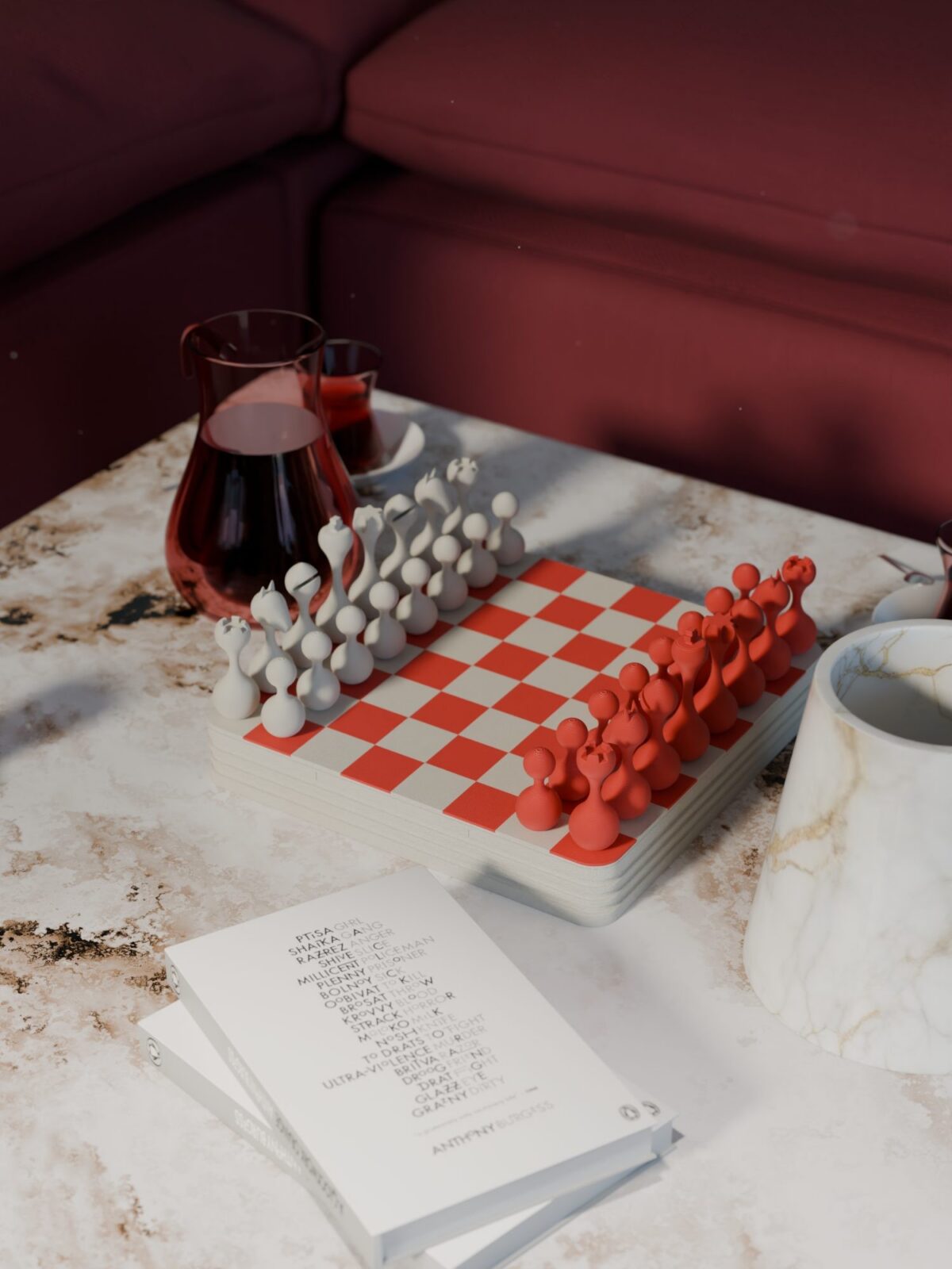 Accueil Échiquier rea rouge et blanc sur une table basse en marbre devant un canapé bordeaux